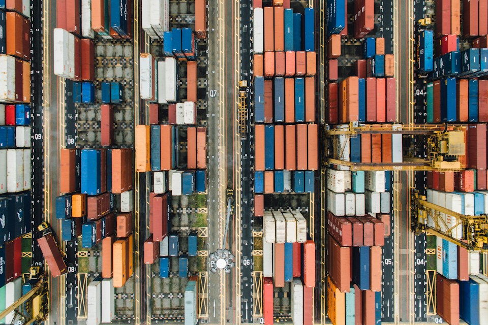 Aerial view of shipping containers and freight lanes at a port